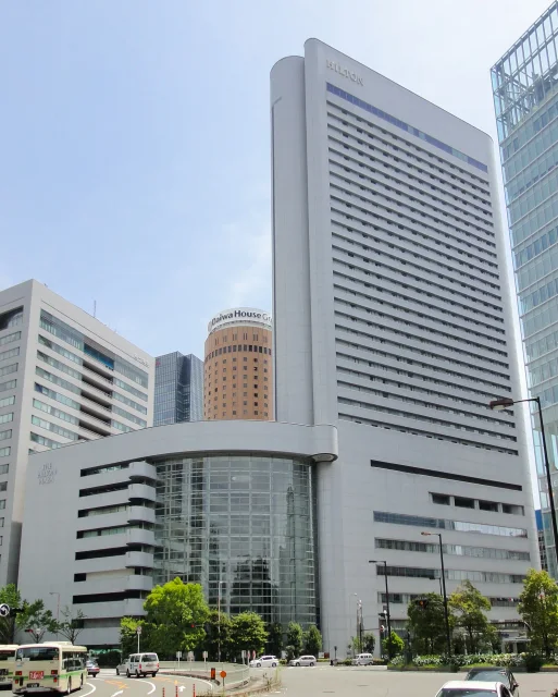 YOSHIMOTO BUILDING · Photograph of Yoshimoto Building, including Hilton Plaza East (left, shorter site) and Hilton Osaka (right, taller site), in Kita-ku, Osaka, Osaka Prefecture, Japan.